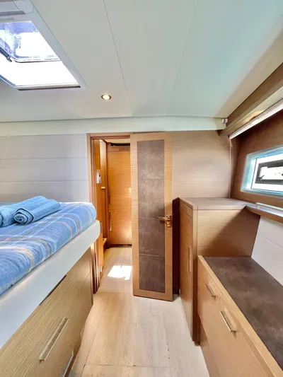  Yacht Photos Pics Luxurious interior of 2018 Lagoon 620 yacht cabin with modern furnishings and natural light.