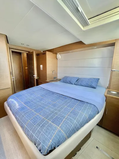  Yacht Photos Pics Luxurious bedroom interior of 2018 Lagoon 620 yacht with modern design and cozy bedding.