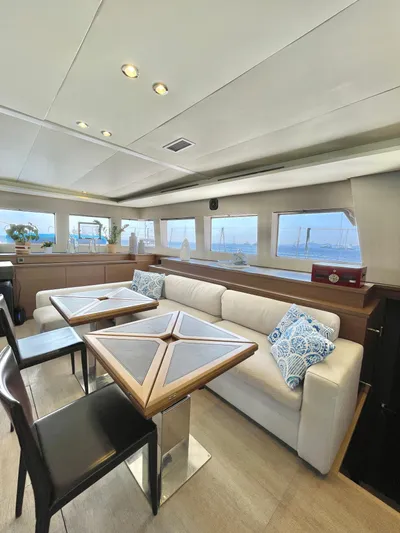  Yacht Photos Pics Luxurious interior of 2018 Lagoon 620 yacht with elegant seating and ocean views.