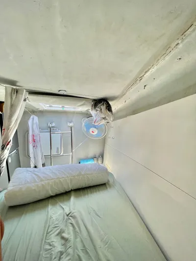  Yacht Photos Pics Interior cabin of 2018 Lagoon 620 yacht with bed and fan.