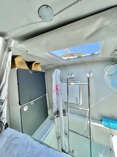  Yacht Photos Pics Interior of 2018 Lagoon 620 yacht with skylight, ladder, and storage.