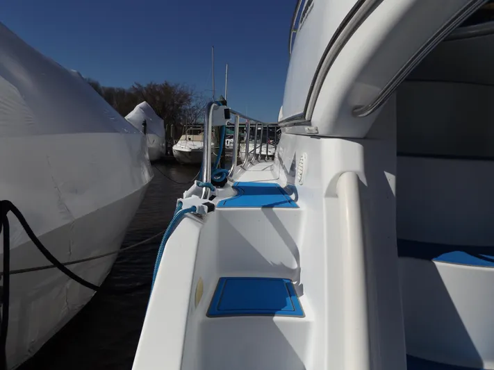  Yacht Photos Pics 2003 Carver 360 Sport Sedan yacht docked, showcasing sleek design and blue accents.