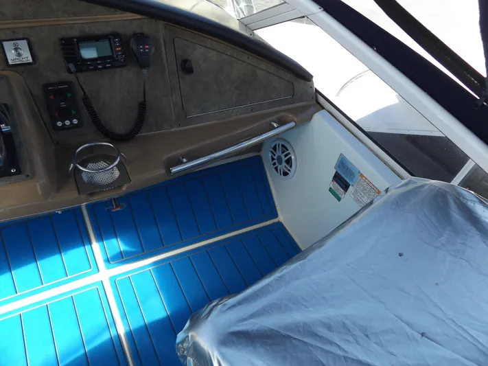  Yacht Photos Pics 2003 Carver 360 Sport Sedan cockpit with blue flooring and control panel.