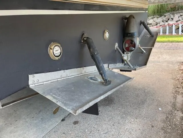  Yacht Photos Pics 2003 Carver 360 Sport Sedan stern with trim tabs and exhaust outlets.