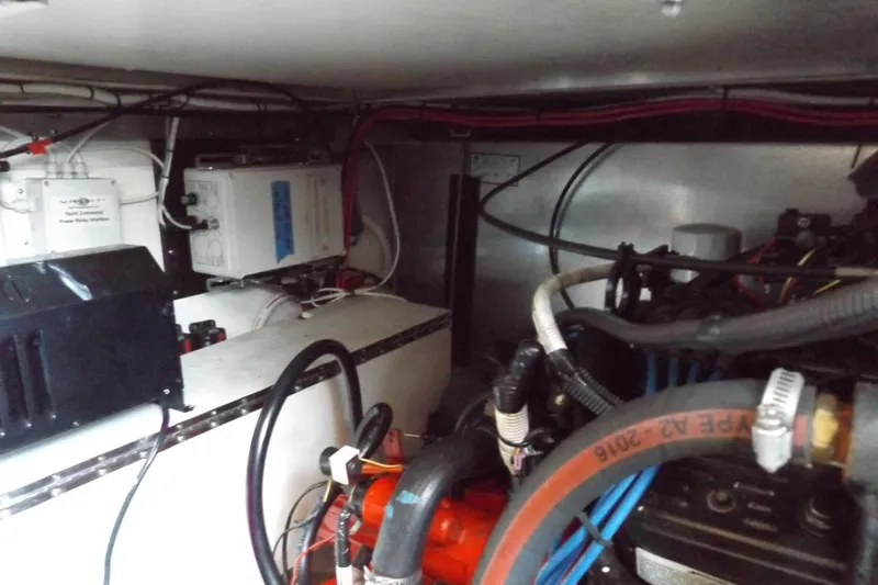  Yacht Photos Pics Engine room of a 2003 Carver 360 Sport Sedan with visible wiring and components.