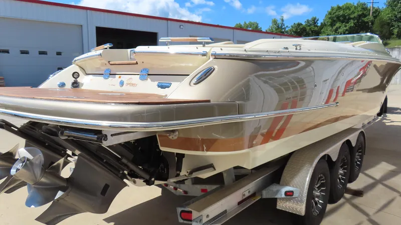  Yacht Photos Pics 2018 Chris-Craft Launch 34 boat on trailer, showcasing sleek design and polished finish.