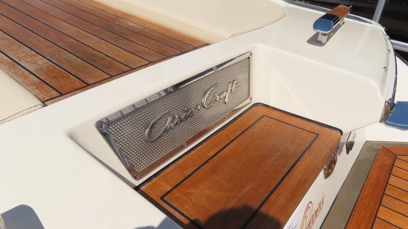  Yacht Photos Pics 2018 Chris-Craft Launch 34 boat with teak wood deck and branded metal plate.