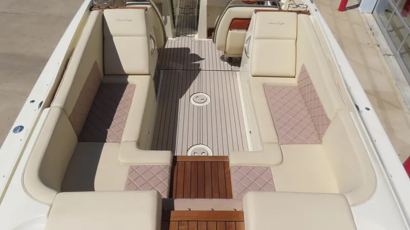  Yacht Photos Pics 2018 Chris-Craft Launch 34 interior with beige seating and wooden flooring.