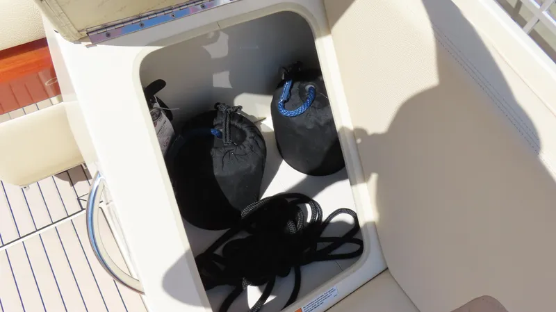  Yacht Photos Pics Storage compartment on 2018 Chris-Craft Launch 34 boat with ropes and bags.