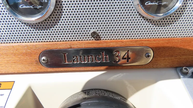  Yacht Photos Pics 2018 Chris-Craft Launch 34 dashboard with nameplate and gauges.