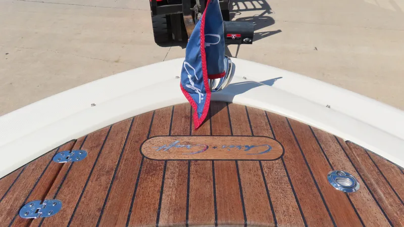  Yacht Photos Pics 2018 Chris-Craft Launch 34 boat deck with wooden finish and flag.