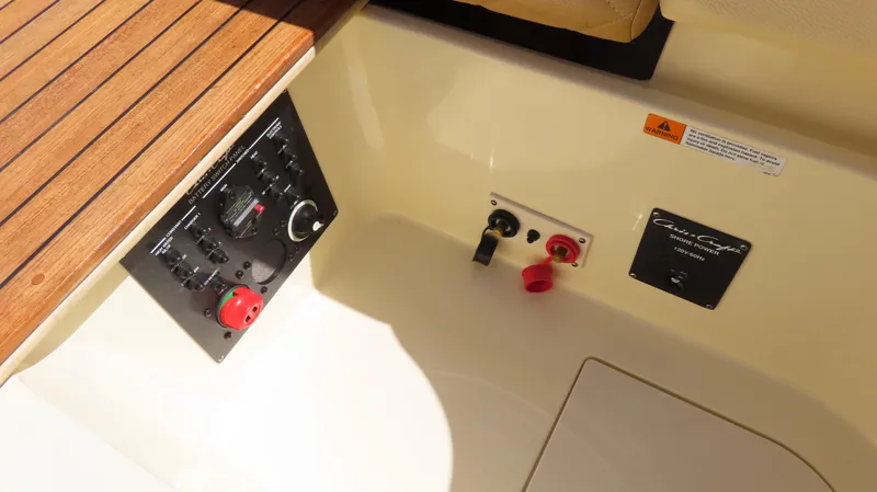 Yacht Photos Pics 2018 Chris-Craft Launch 34 control panel with wooden trim and power switches.