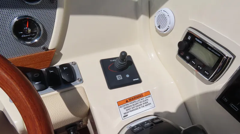  Yacht Photos Pics 2018 Chris-Craft Launch 34 dashboard with controls, gauges, and warning label.