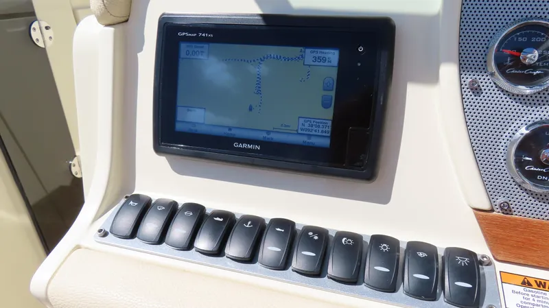  Yacht Photos Pics Control panel of 2018 Chris-Craft Launch 34 with Garmin GPS and switches.
