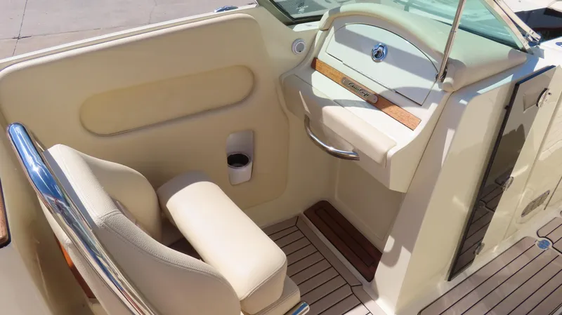  Yacht Photos Pics 2018 Chris-Craft Launch 34 interior with beige seating and wooden accents.