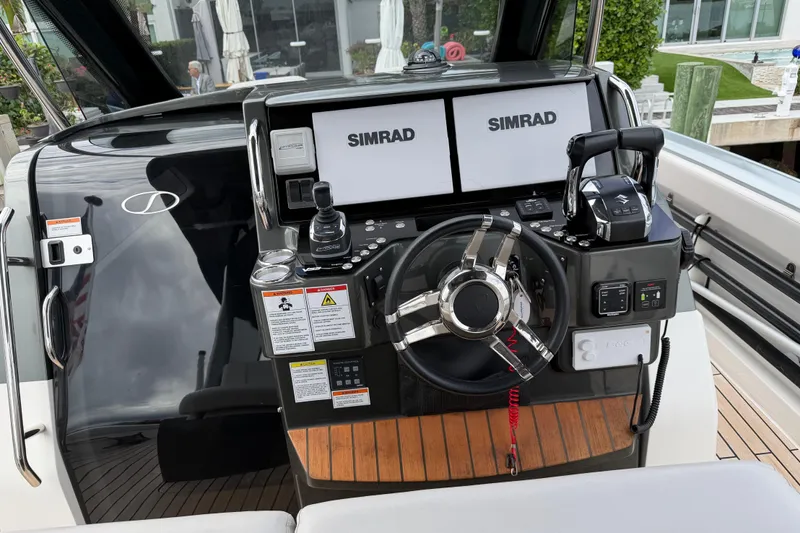  Yacht Photos Pics 2023 Schaefer V33 boat dashboard with dual Simrad displays and modern controls.