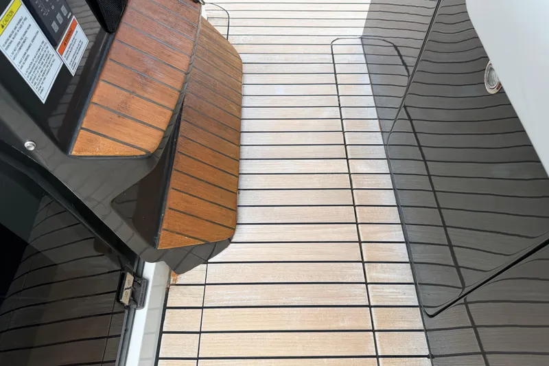  Yacht Photos Pics Teak deck of 2023 Schaefer V33 yacht, showcasing elegant wood finish and modern design.