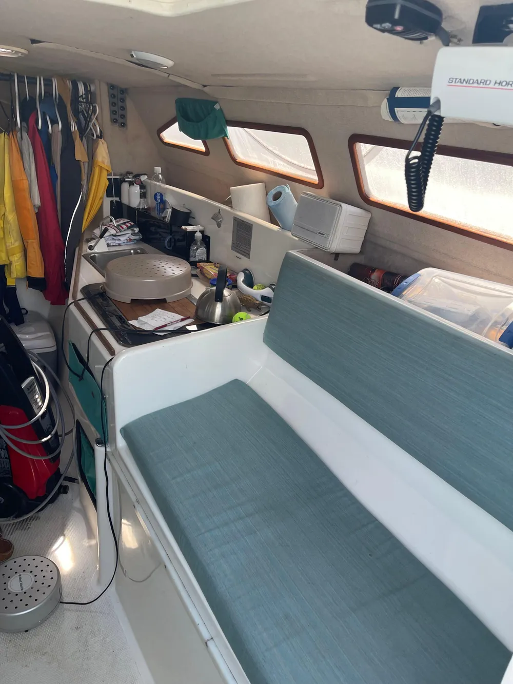 Interior of a 1996 Corsair F-31 sailboat with seating and storage.