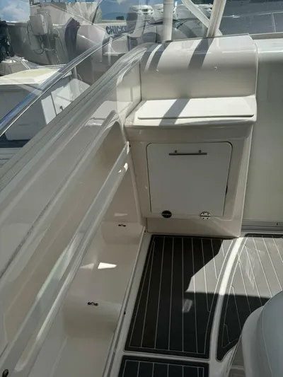 T-party Yacht Photos Pics 2012 Everglades LX 350 boat interior with storage compartment and seating area.