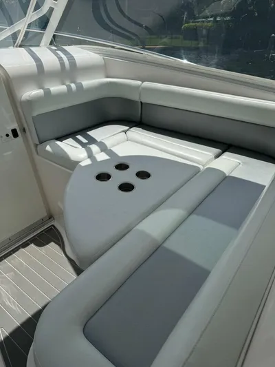 T-party Yacht Photos Pics 2012 Everglades LX 350 boat interior with cushioned seating and cup holders.