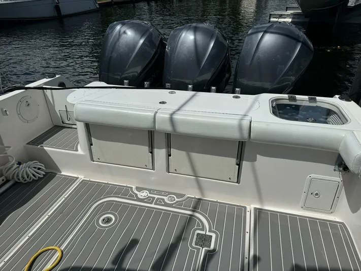 T-party Yacht Photos Pics 2012 Everglades LX 350 boat deck with triple outboard motors.