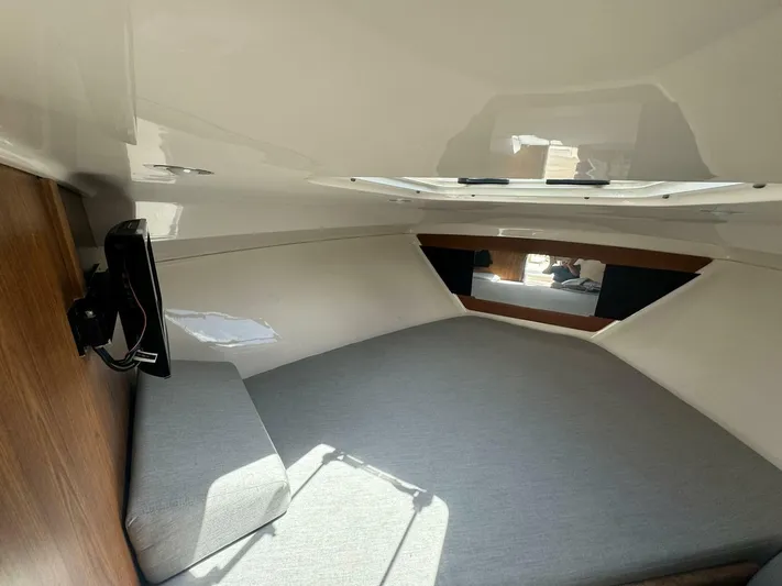 T-party Yacht Photos Pics Interior cabin of 2012 Everglades LX 350 boat with bed and window.