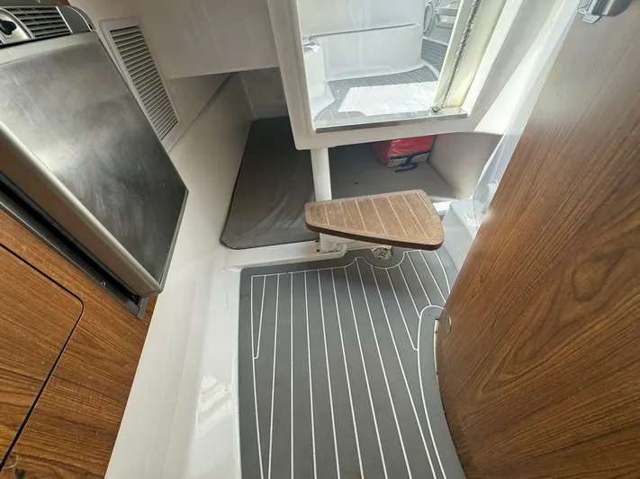 T-party Yacht Photos Pics Interior of 2012 Everglades LX 350 boat with wood accents and modern design.