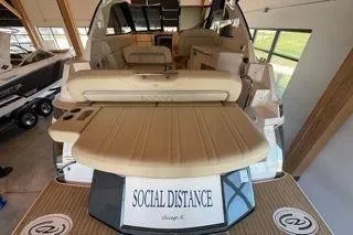 Social Distance Yacht Photos Pics 2019 Regal 35 Sport Coupe boat with "Social Distance" sign on deck.