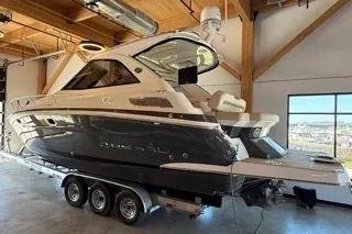 Social Distance Yacht Photos Pics 2019 Regal 35 Sport Coupe boat on trailer in indoor storage.