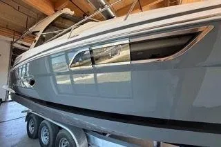 Social Distance Yacht Photos Pics 2019 Regal 35 Sport Coupe boat on trailer in indoor storage.