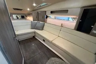 Social Distance Yacht Photos Pics 2019 Regal 35 Sport Coupe interior with beige seating and modern design.