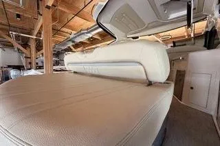 Social Distance Yacht Photos Pics 2019 Regal 35 Sport Coupe interior with beige leather seating and modern design.