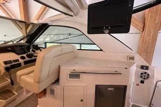 Social Distance Yacht Photos Pics 2019 Regal 35 Sport Coupe interior with helm, seating, and entertainment system.