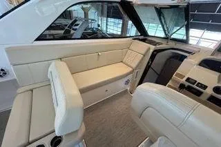 Social Distance Yacht Photos Pics 2019 Regal 35 Sport Coupe interior with beige seating and modern dashboard.