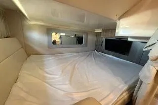 Social Distance Yacht Photos Pics Interior cabin of 2019 Regal 35 Sport Coupe with bed and window view.