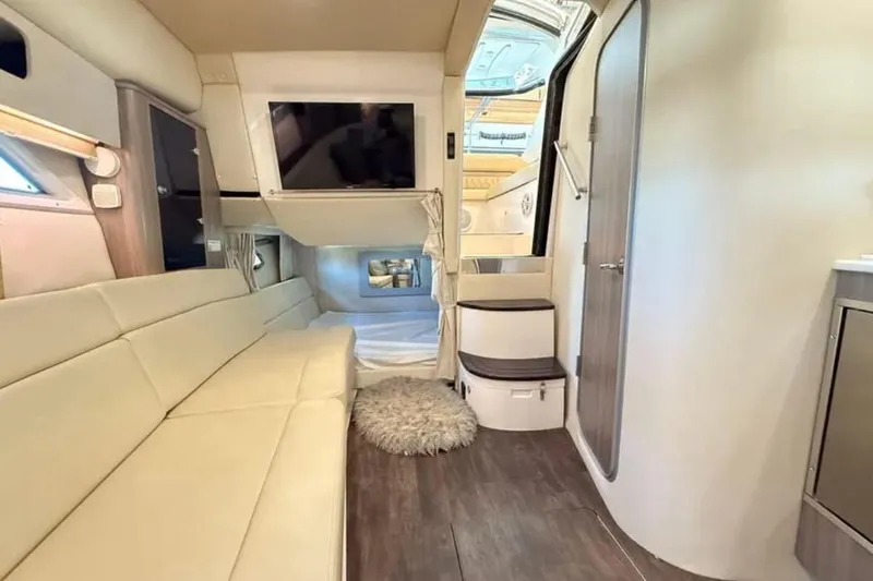 Social Distance Yacht Photos Pics Interior of 2019 Regal 35 Sport Coupe, featuring modern seating and entertainment area.