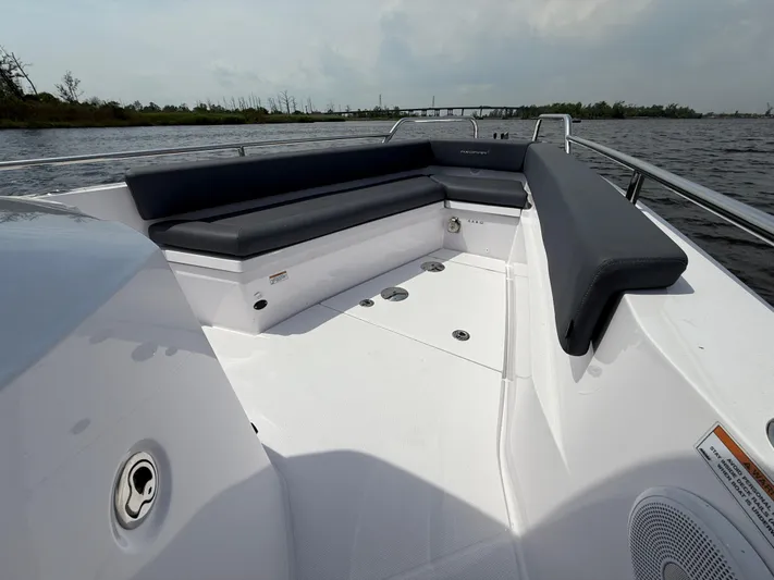  Yacht Photos Pics 2021 Axopar 28 CABIN boat with spacious seating on a calm waterway.