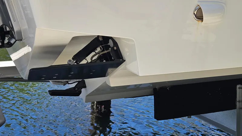  Yacht Photos Pics 2023 SeaVee 370z boat hull detail with trim tab, near water surface.