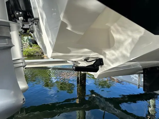  Yacht Photos Pics 2023 SeaVee 370z boat hull and motor detail in water.