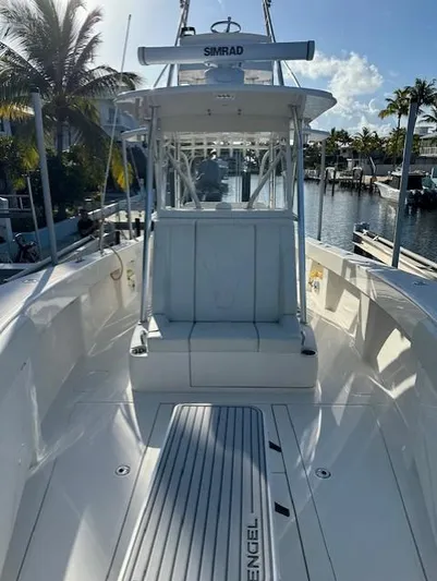  Yacht Photos Pics 2023 SeaVee 370z boat docked, featuring a spacious deck and modern design.