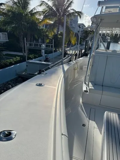  Yacht Photos Pics 2023 SeaVee 370z boat docked, featuring sleek design and spacious deck.