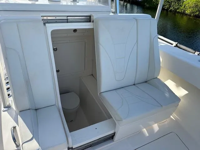  Yacht Photos Pics 2023 SeaVee 370z boat interior with white seating and hidden compartment.