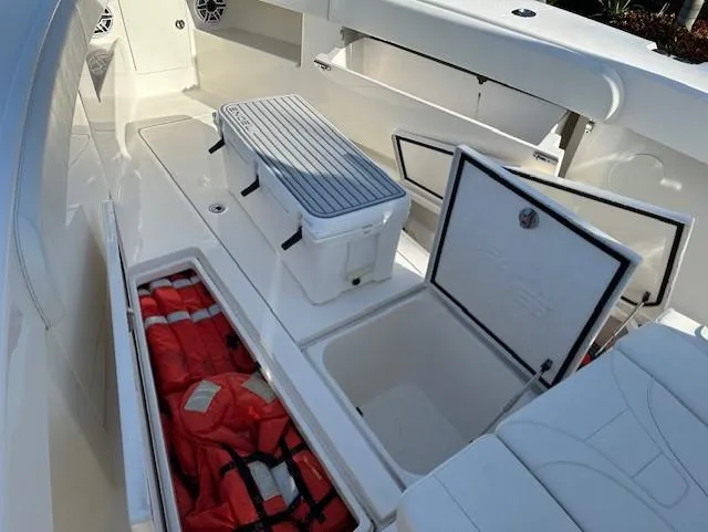  Yacht Photos Pics 2023 SeaVee 370z boat interior with storage compartments and safety gear.
