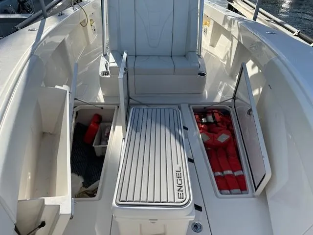  Yacht Photos Pics 2023 SeaVee 370z boat deck with storage compartments and safety equipment.