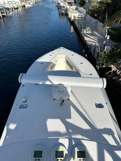  Yacht Photos Pics 2023 SeaVee 370z boat docked in a canal, top view.