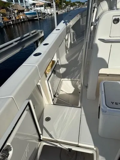  Yacht Photos Pics 2023 SeaVee 370z boat deck with storage compartments and Yeti cooler.