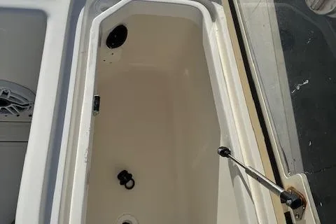  Yacht Photos Pics 2023 SeaVee 370z boat storage compartment with open lid and latch mechanism.