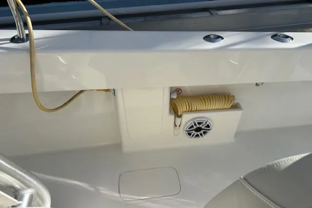  Yacht Photos Pics 2023 SeaVee 370z boat deck with coiled hose and speaker.
