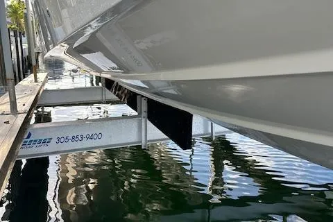  Yacht Photos Pics 2023 SeaVee 370z boat on lift, dockside view.