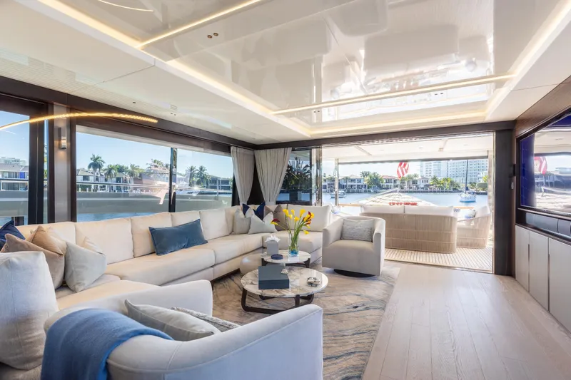 White Star Yacht Photos Pics Luxurious interior of 2023 Sunseeker 90 Ocean yacht with elegant seating and waterfront view.